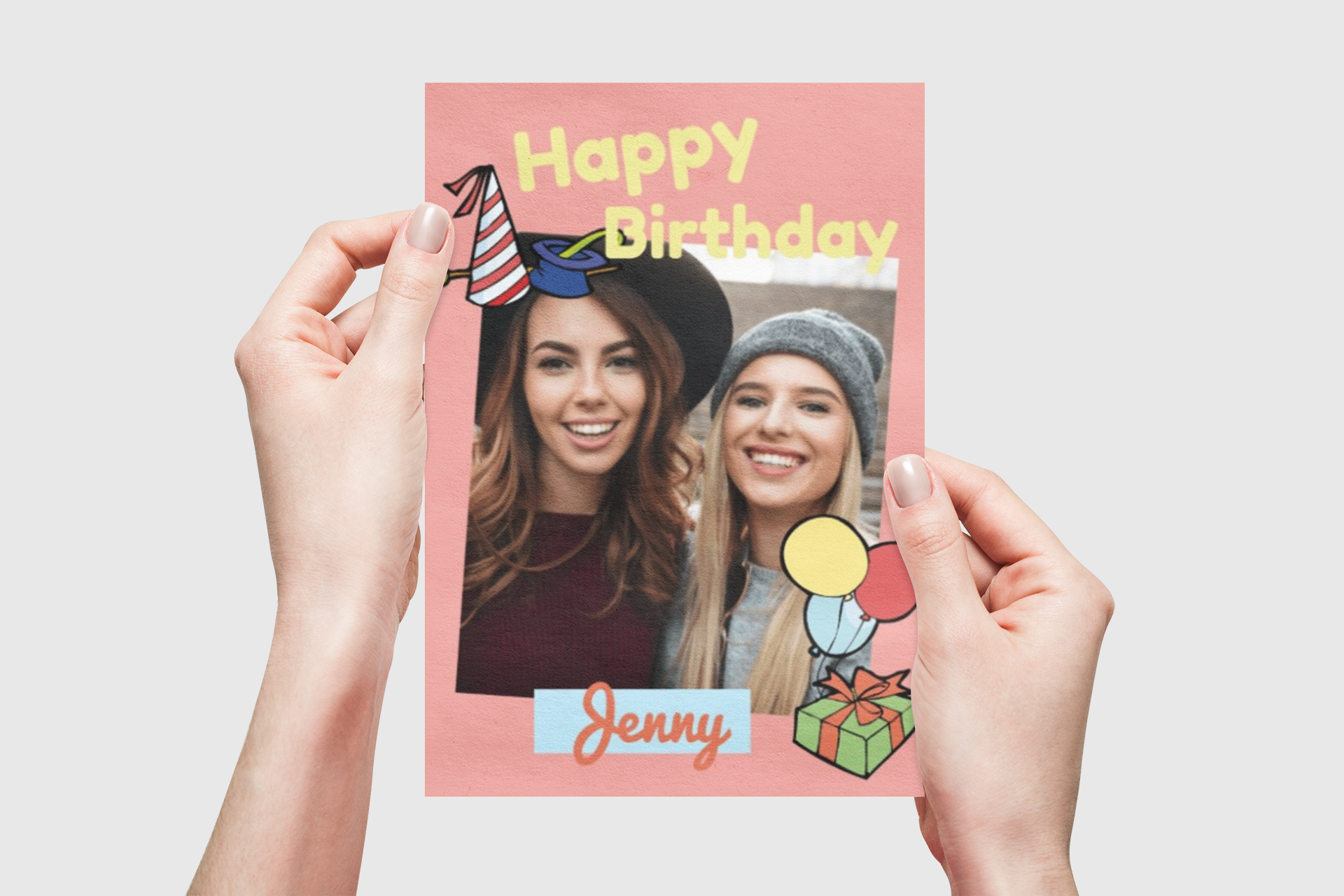 Hands holding a personalized Happy Birthday card